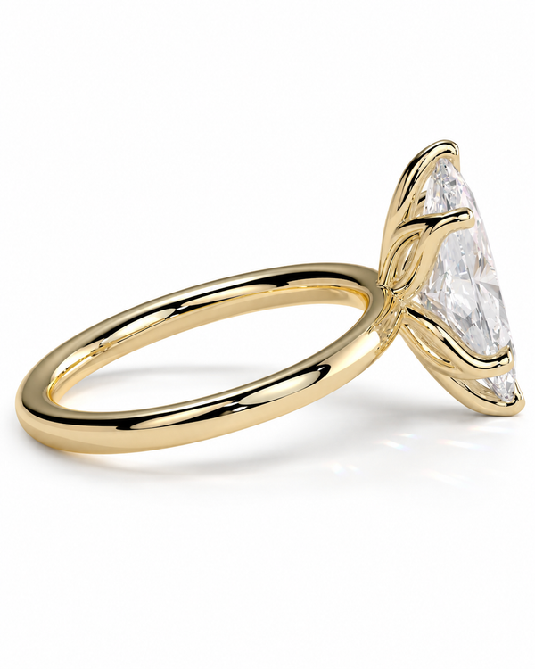 color_10K_YG, color_14K_YG &&A yellow gold ring featuring a large marquise-cut clear gemstone in a prong setting, shown on a clean white background.