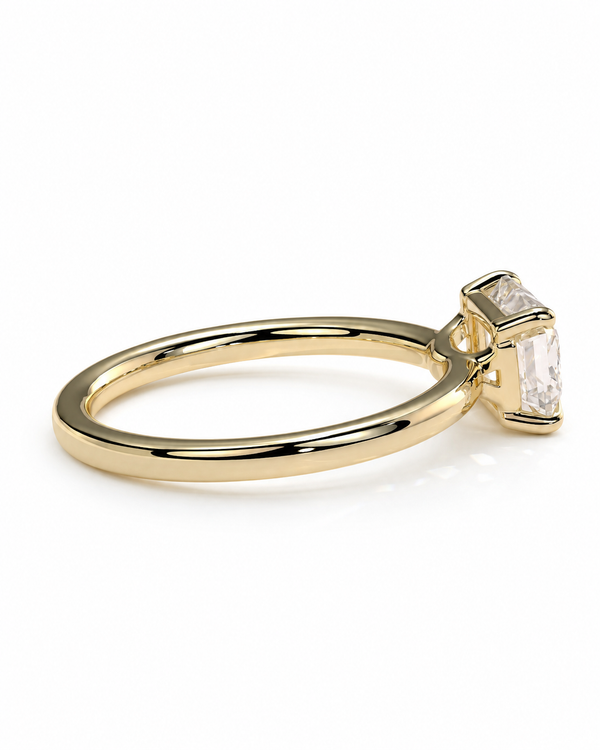 color_10K_YG, color_14K_YG &&A gold ring with a rectangular clear gemstone in a prong setting, shown on a clean white background.