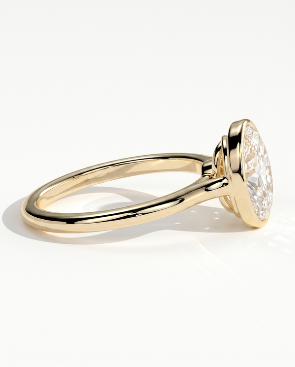 color_10K_YG, color_14K_YG &&A yellow gold solitaire engagement ring with a marquise-cut clear gemstone, shown from a side profile on a clean white background.