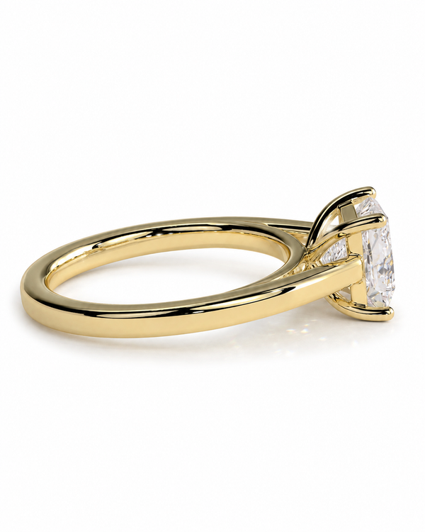 color_10K_YG, color_14K_YG &&A yellow gold solitaire engagement ring with a marquise-cut clear gemstone, shown from a side profile view on a clean white background.