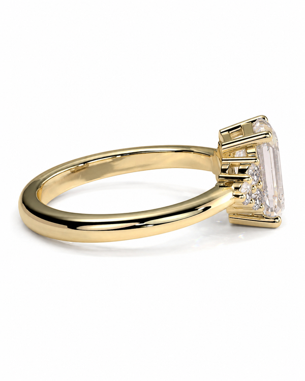 color_10K_YG, color_14K_YG &&A yellow gold ring featuring a large rectangular emerald-cut clear gemstone in a prong setting, shown on a clean white background.