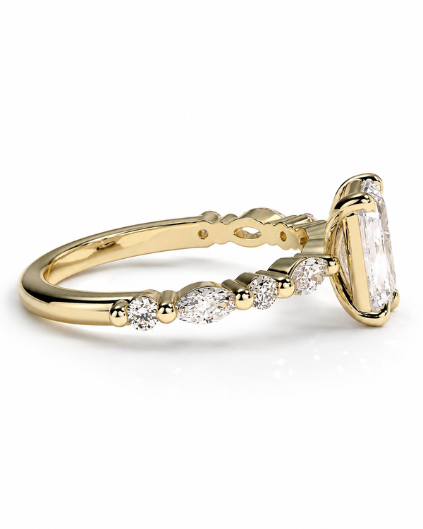 color_10K_YG, color_14K_YG &&
A yellow gold ring featuring a large rectangular clear gemstone in a bezel setting, with smaller marquise and round-cut clear stones along the band, shown on a white background.