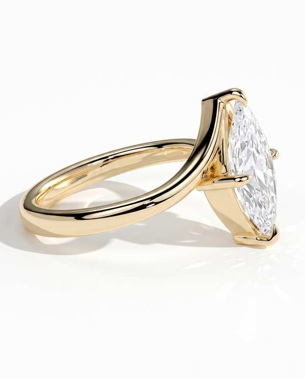color_10K_YG, color_14K_YG &&
A yellow gold ring featuring a large marquise-cut clear gemstone in a prong setting, shown from a side angle on a clean white background.