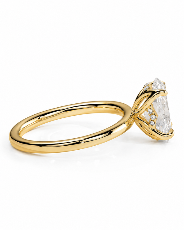 color_10K_YG, color_14K_YG &&A yellow gold ring with a large clear marquise-cut center stone and smaller side stones, shown on a clean white background.