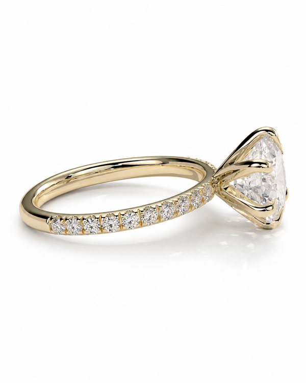 color_10K_YG, color_14K_YG &&
A yellow gold diamond ring with a large triangular-cut center stone and a pave band set with small round diamonds, shown on a clean white background.