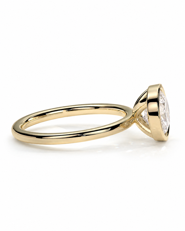 color_10K_YG, color_14K_YG && yellow gold solitaire engagement ring with a marquise-cut clear gemstone, shown in a side profile view on a clean white background.