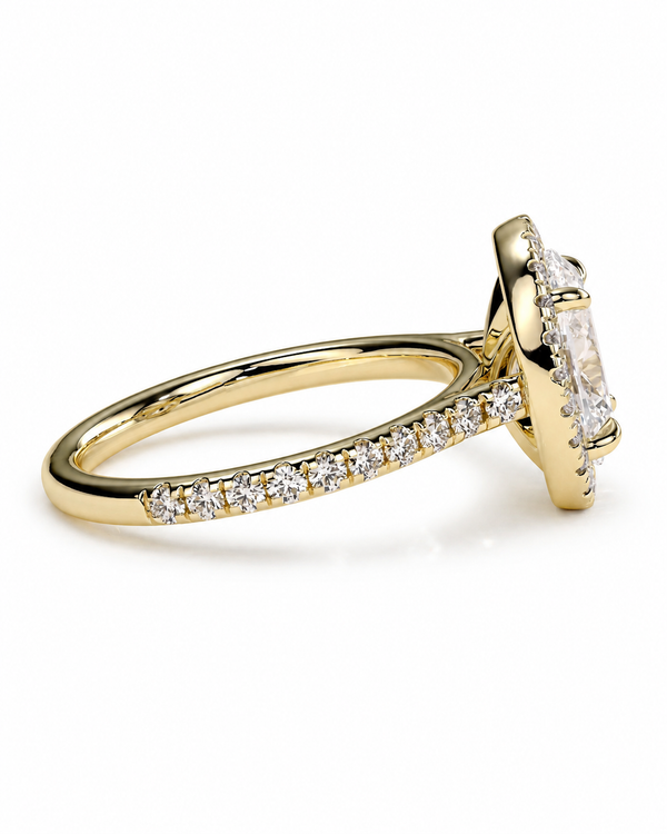 color_10K_YG, color_14K_YG &&A yellow gold ring featuring a large rectangular clear gemstone in a prong setting, with a pavé band of small round diamonds, shown on a white background.