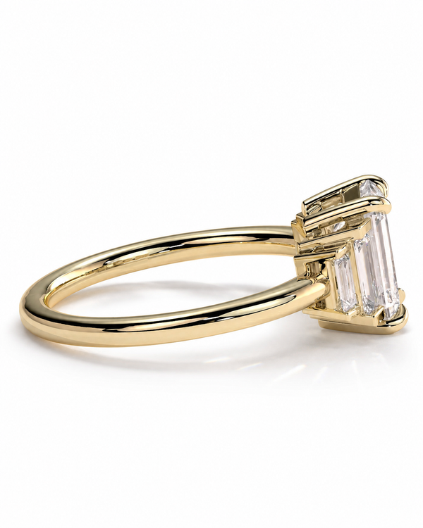 color_10K_YG, color_14K_YG &&A yellow gold ring featuring a bezel-set cluster of clear baguette and round-cut gemstones, shown from a side angle on a clean white background.