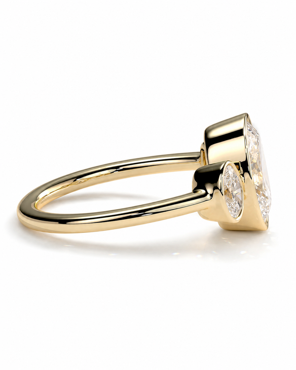 color_10K_YG, color_14K_YG &&A yellow gold ring with a marquise-cut diamond and a small round diamond accent on the side, shown on a clean white background.