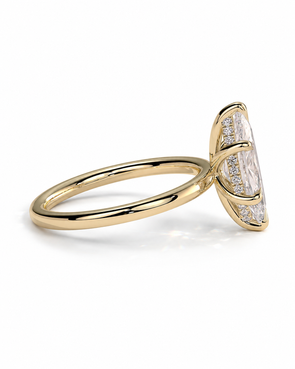 color_10K_YG, color_14K_YG &&A yellow gold ring featuring a large marquise-cut clear gemstone in a prong setting, accented with small pavé diamonds along the sides, shown on a clean white background.