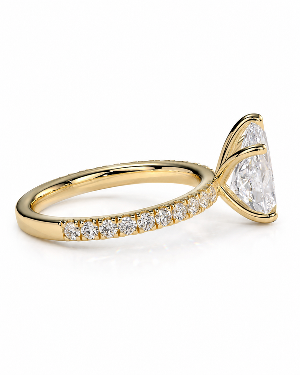 color_10K_YG, color_14K_YG &&Side profile of a pear moissanite ring showcasing the elegant prong setting.