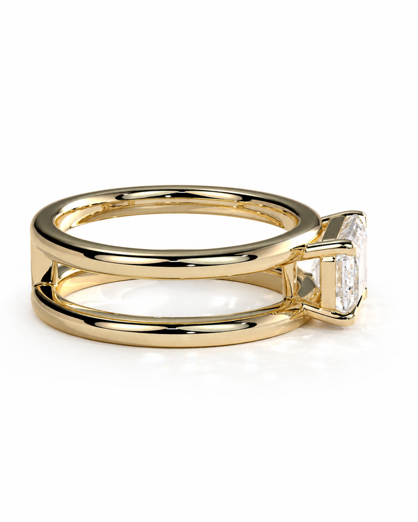color_10K_YG, color_14K_YG &&A gold ring with a split shank design and a rectangular clear gemstone, shown on a plain white background.