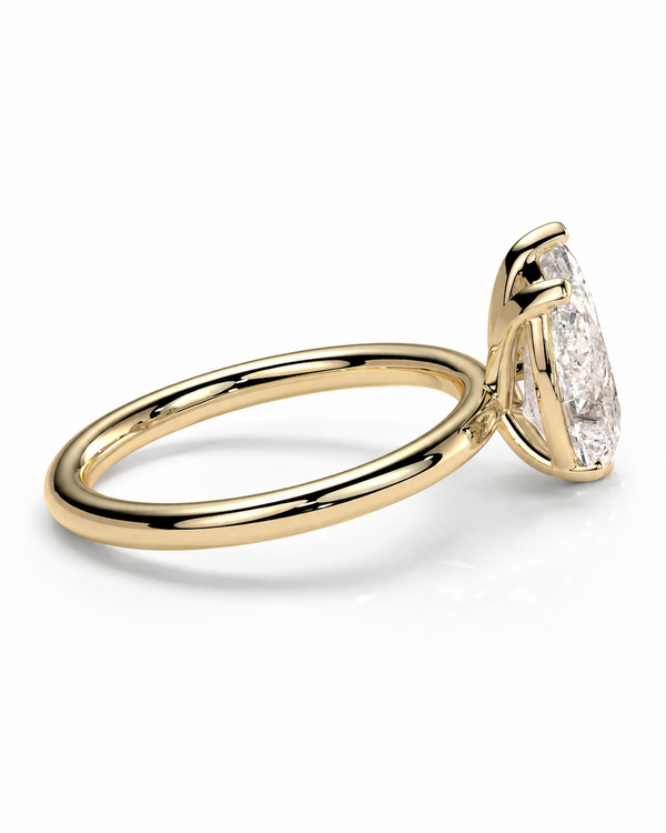 color_10K_YG, color_14K_YG &&A yellow gold solitaire engagement ring featuring a marquise-cut diamond, shown in a three-quarter side view on a clean white background.