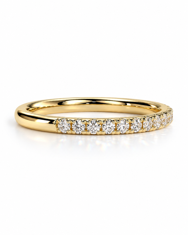 color_10K_YG, color_14K_YG &&A
A yellow gold eternity ring featuring a row of round-cut clear gemstones set in a prong setting, shown on a clean white background with a soft reflection.