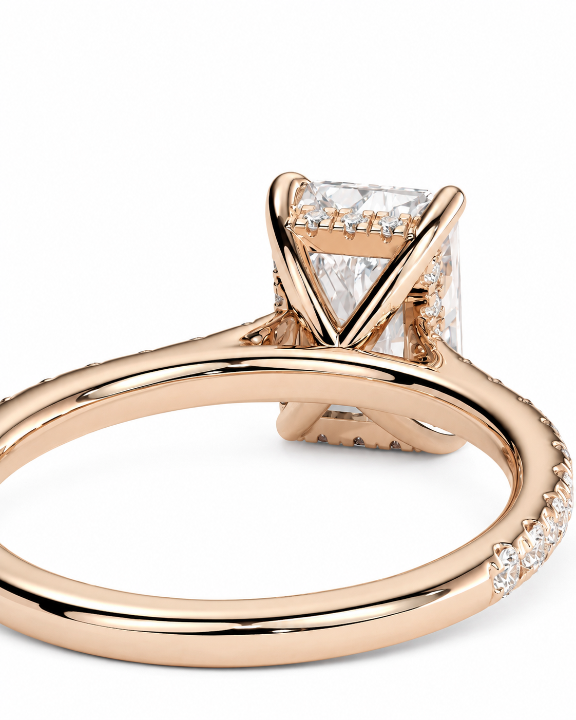 color_10K_RG, color_14K_RG &&
Rose gold diamond ring with a rectangular clear gemstone in a prong setting, featuring a shank with small pave diamonds on a white background.