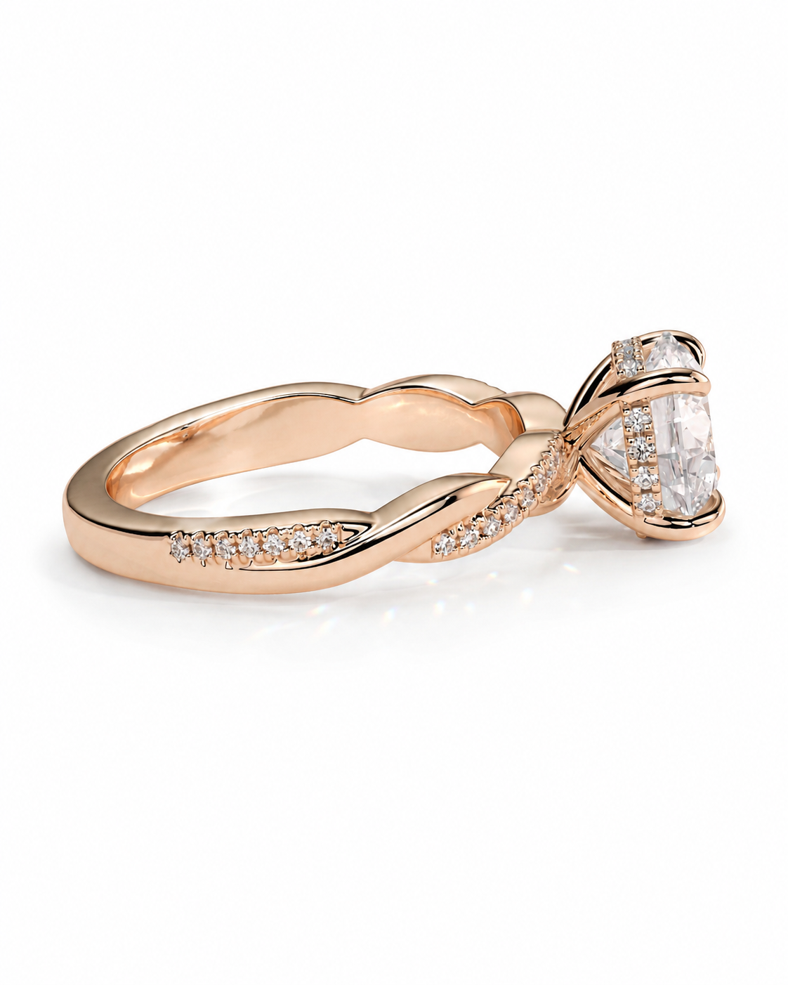 color_10K_RG, color_14K_RG &&
A rose gold twist band ring featuring a large oval-cut clear center stone and small pave-set accent stones along the band, shown on a clean white background.