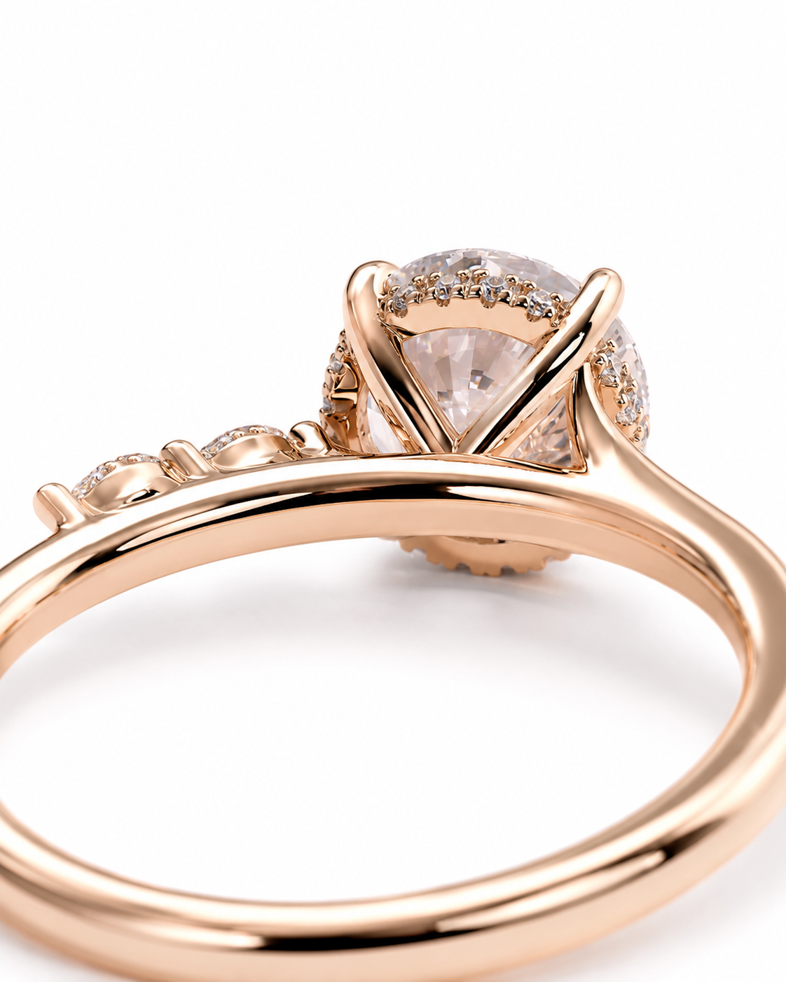 color_10K_RG, color_14K_RG &&
Rose gold ring with a large oval clear center stone and small pave accents, photographed close-up on a white background.