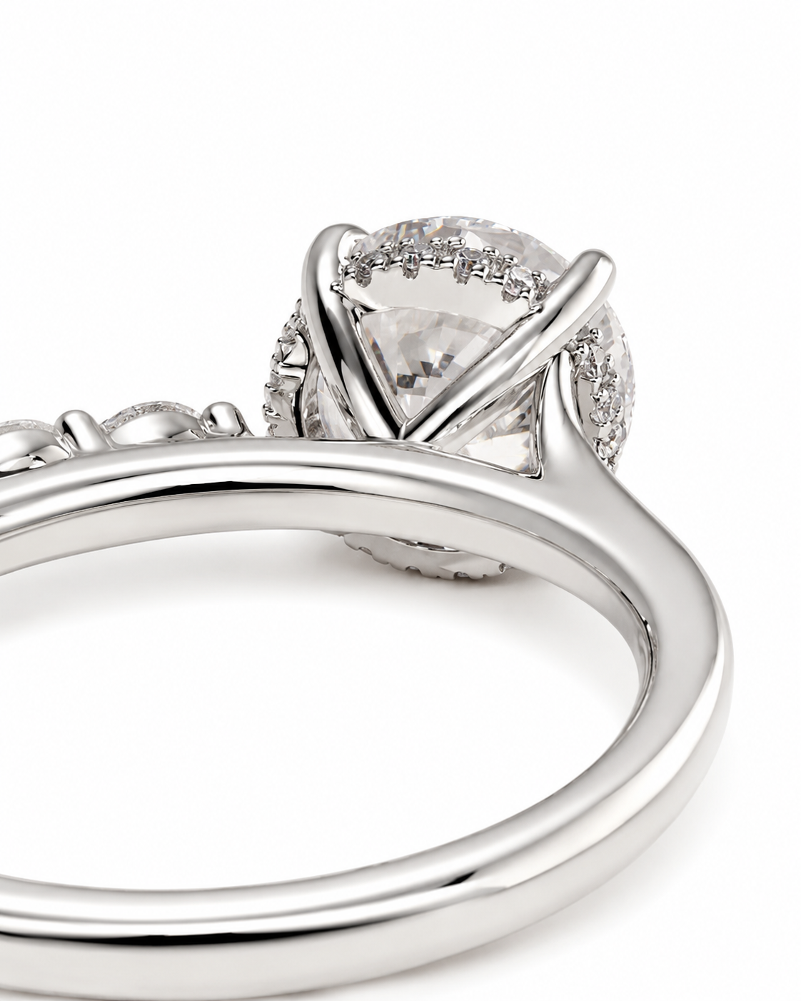 color_925_SIL,color_935_ARG,color_10K_WG, color_14K_WG &&
A close-up of a silver-toned ring featuring a large oval clear center stone surrounded by a halo of small clear stones, shown on a plain white background.