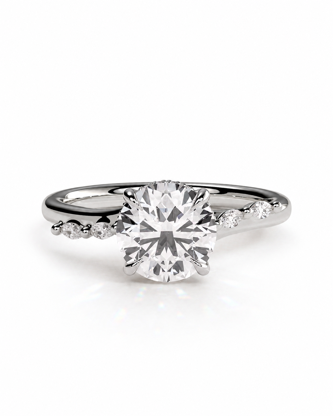 color_925_SIL,color_935_ARG,color_10K_WG, color_14K_WG &&
A silver-tone solitaire engagement ring with a round brilliant-cut center stone and small accent stones along the shoulders, shown on a clean white background.
