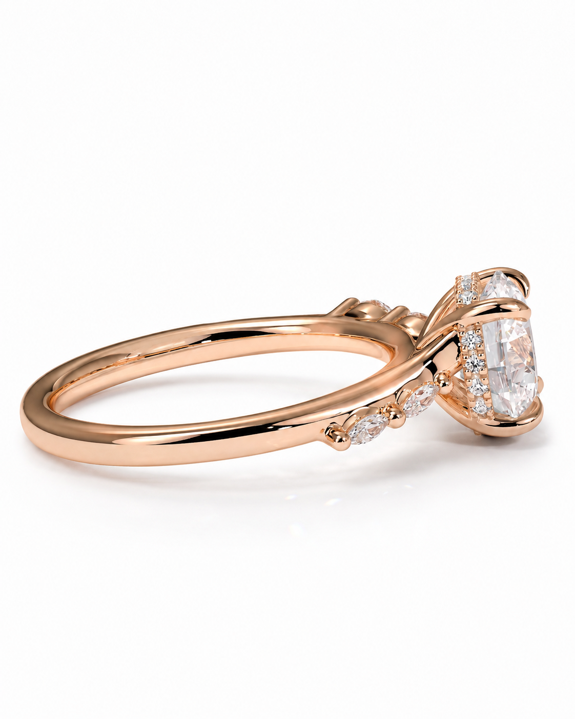 color_10K_RG, color_14K_RG &&
A rose gold engagement ring featuring a large oval-cut center stone in a prong setting, accented by small round stones along the band, shown on a clean white background.