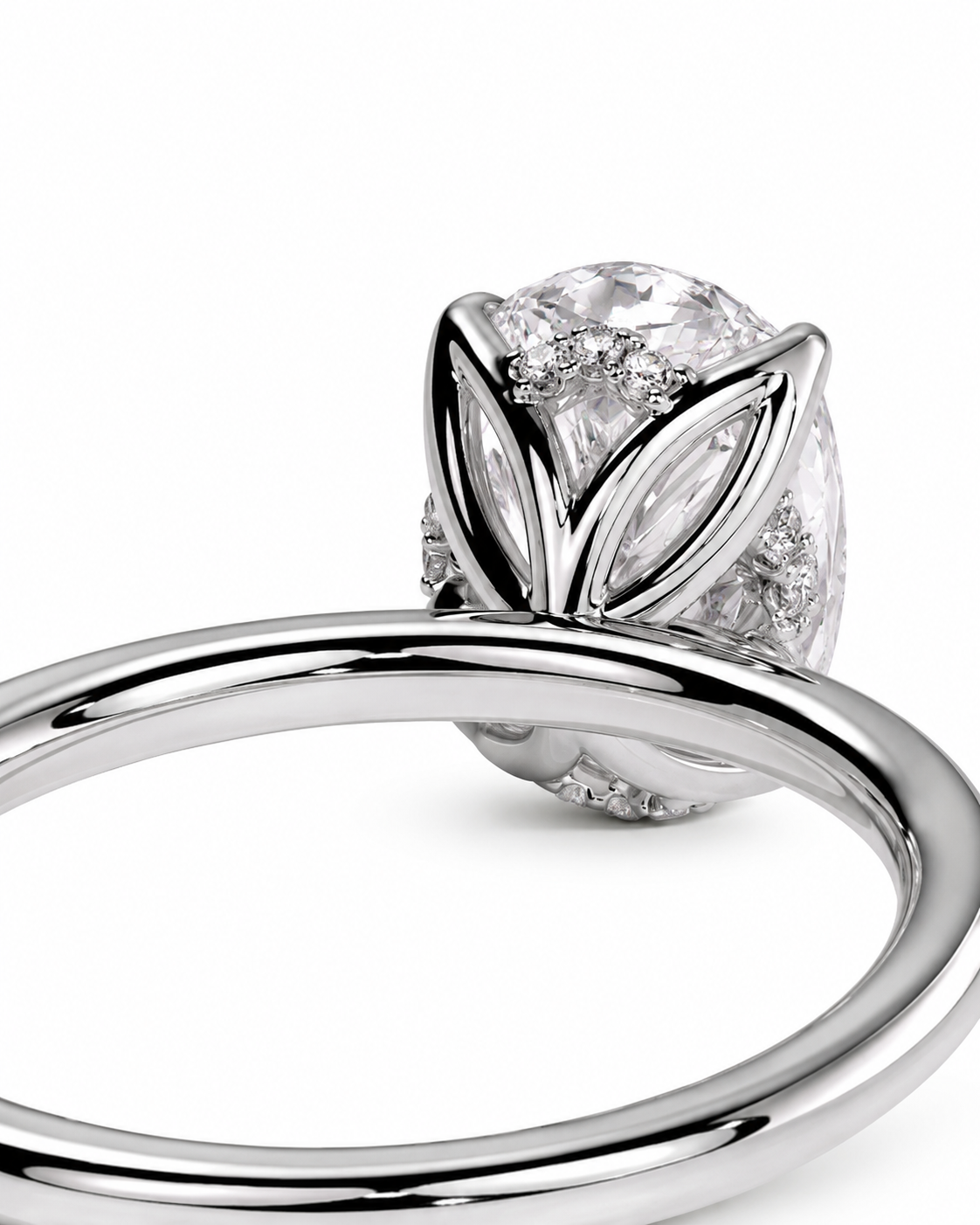 color_925_SIL,color_935_ARG,color_10K_WG, color_14K_WG &&
A close-up studio shot of a silver-toned ring featuring a large clear round-cut center stone surrounded by marquise-cut and round accent stones in a leaf-like setting, with a polished band.