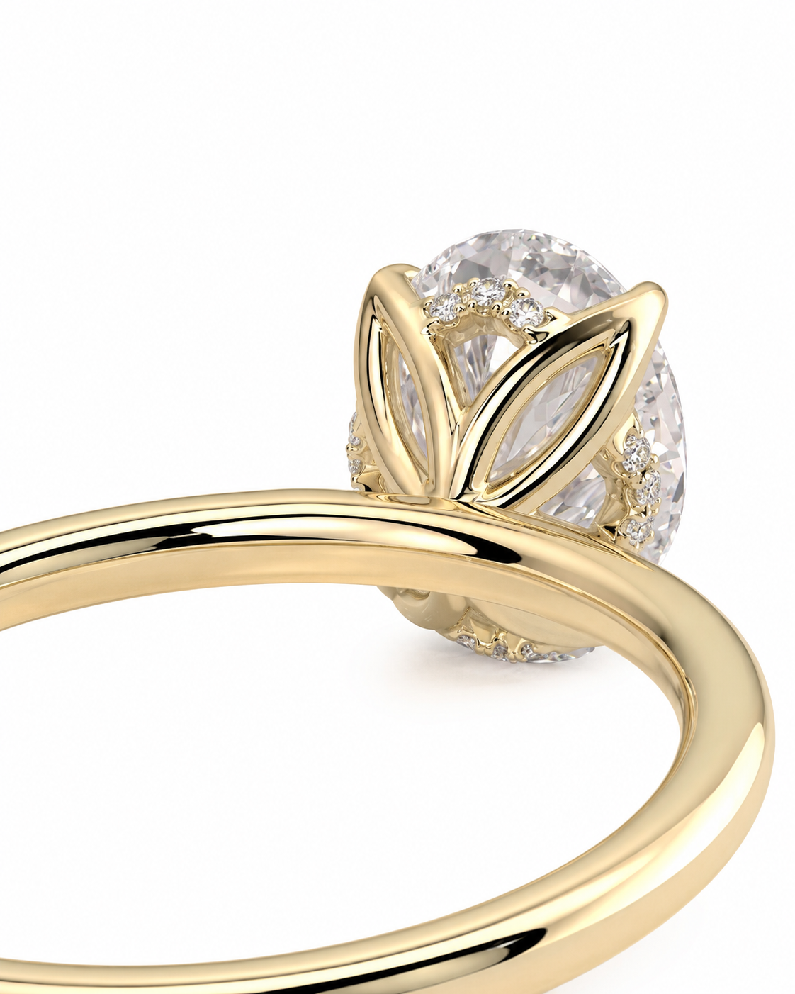 color_10K_YG, color_14K_YG &&
A close-up of a yellow gold ring featuring a large oval clear gemstone in a leaf-like setting with small accent diamonds, shown on a white background.