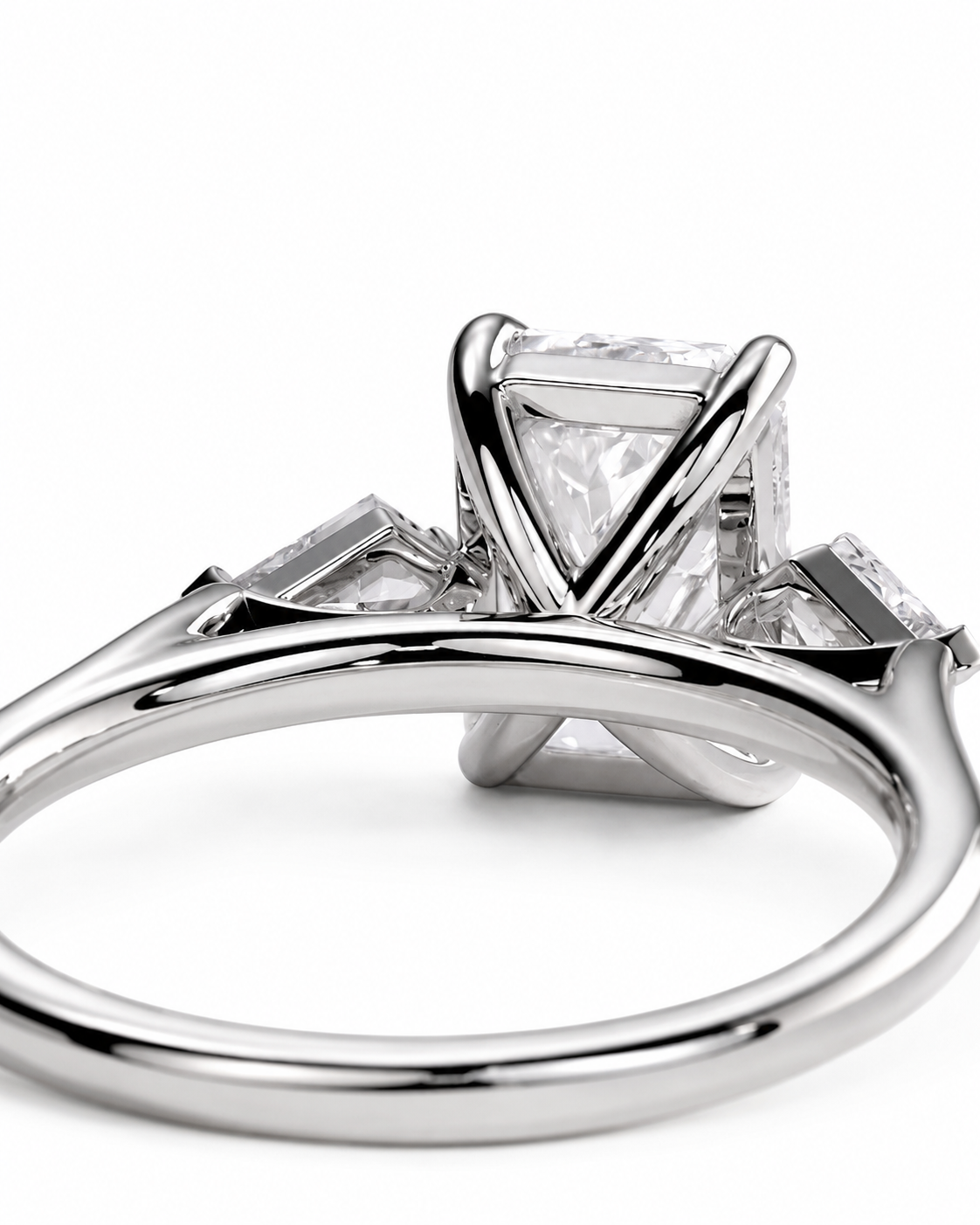 color_925_SIL,color_935_ARG,color_10K_WG, color_14K_WG &&
A close-up shot of a silver engagement ring featuring a rectangular princess-cut center stone and baguette side stones on a white background.