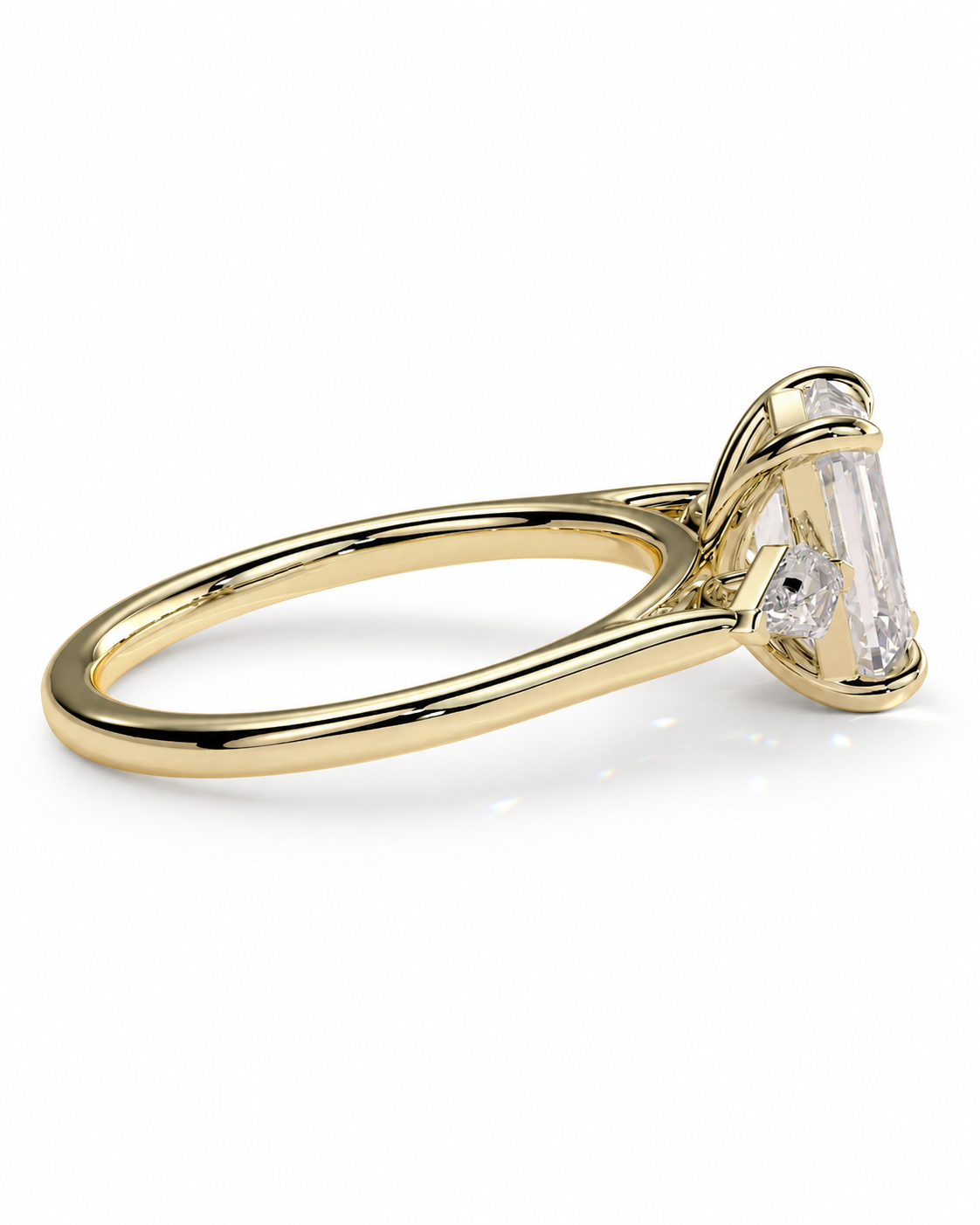 color_10K_YG, color_14K_YG &&
A yellow gold ring with a large emerald-cut clear center stone and smaller side stones, shown on a clean white background.