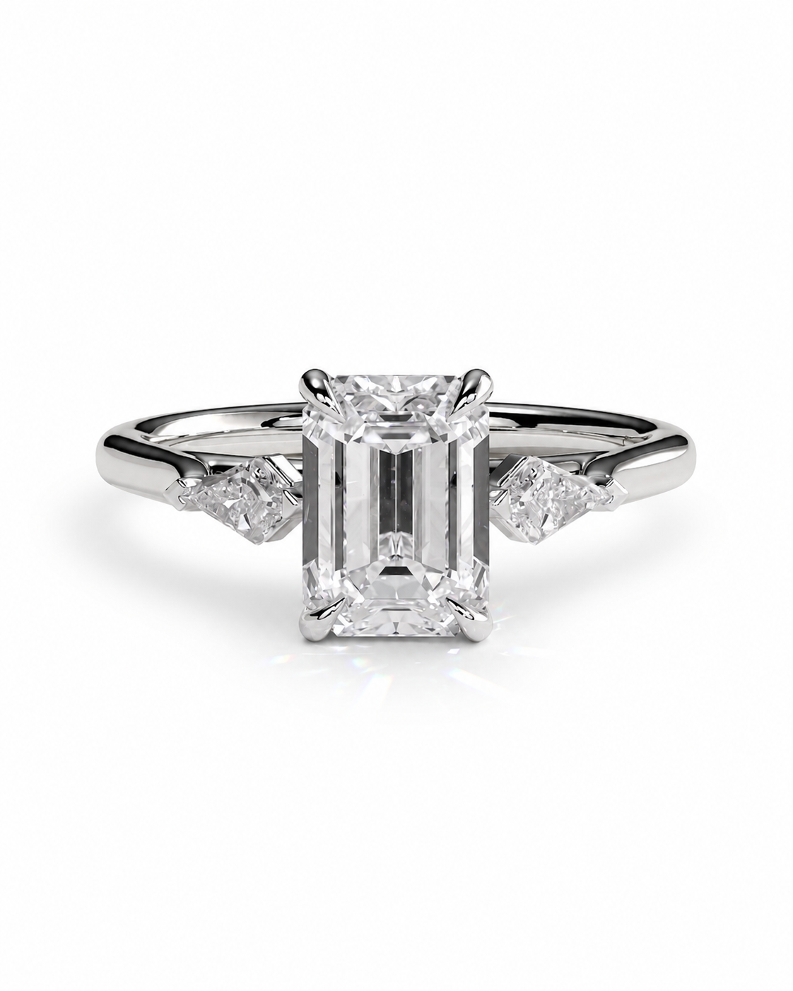 color_925_SIL,color_935_ARG,color_10K_WG, color_14K_WG &&
An emerald-cut diamond engagement ring with a silver-toned band and small side diamonds, centered on a clean white background.