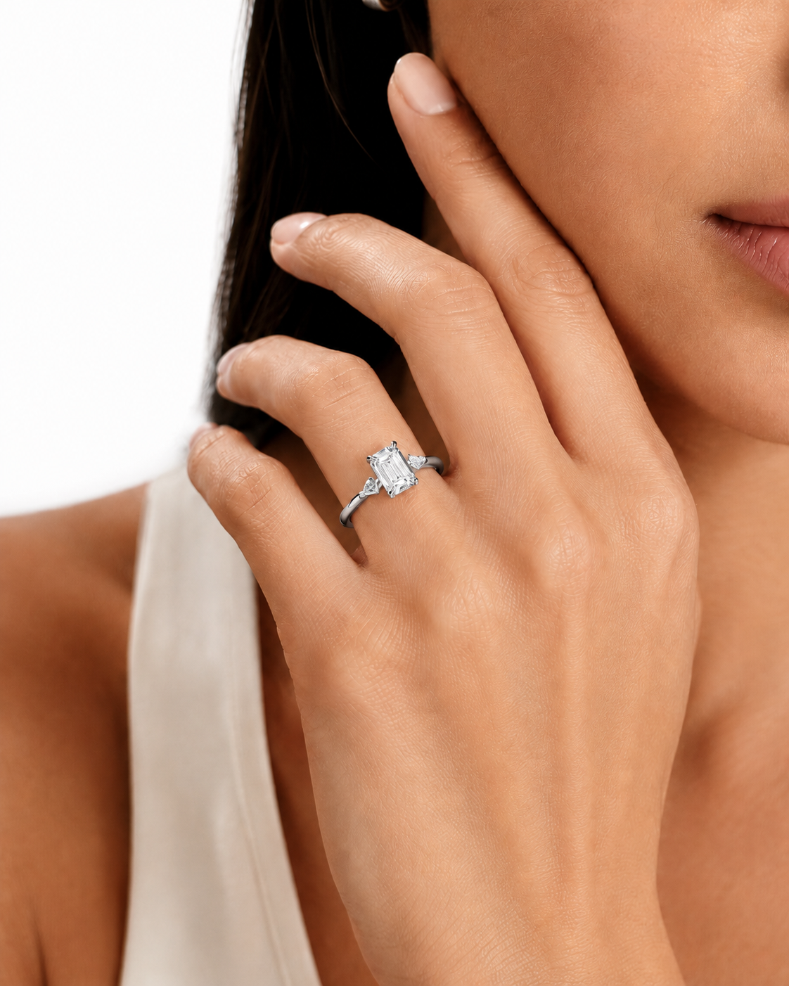 color_925_SIL,color_935_ARG,color_10K_WG, color_14K_WG &&
A close-up lifestyle shot of a woman wearing a silver-toned diamond ring on her finger, with her hand resting near her face against a clean white background.
