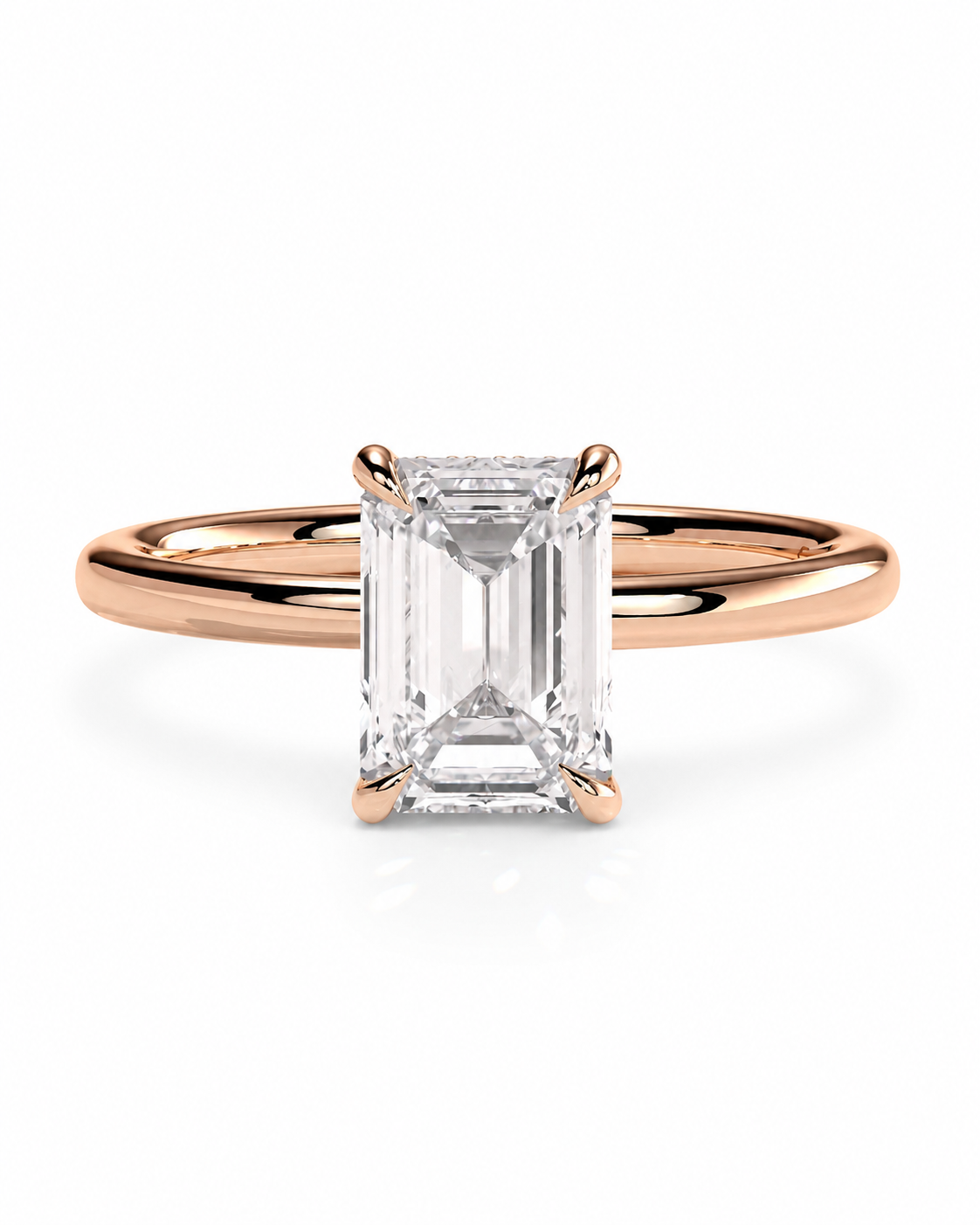 color_10K_RG, color_14K_RG &&
A rose gold engagement ring featuring a rectangular emerald-cut clear diamond center stone in a four-prong setting, shown on a clean white background.