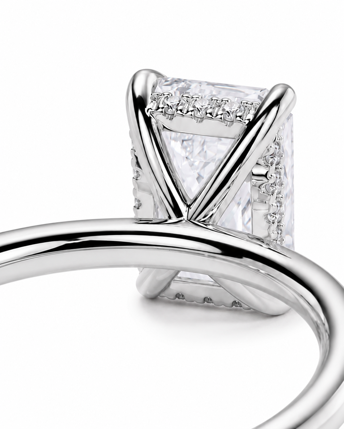 color_925_SIL,color_935_ARG,color_10K_WG, color_14K_WG &&
A close-up of a silver-toned ring featuring a rectangular clear gemstone in a prong setting with small accent stones along the sides, shown on a white background.