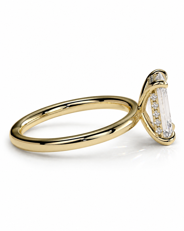 color_10K_YG, color_14K_YG &&
A yellow gold ring featuring a large baguette-cut clear center stone accented by smaller round stones on the setting, shown on a clean white background.