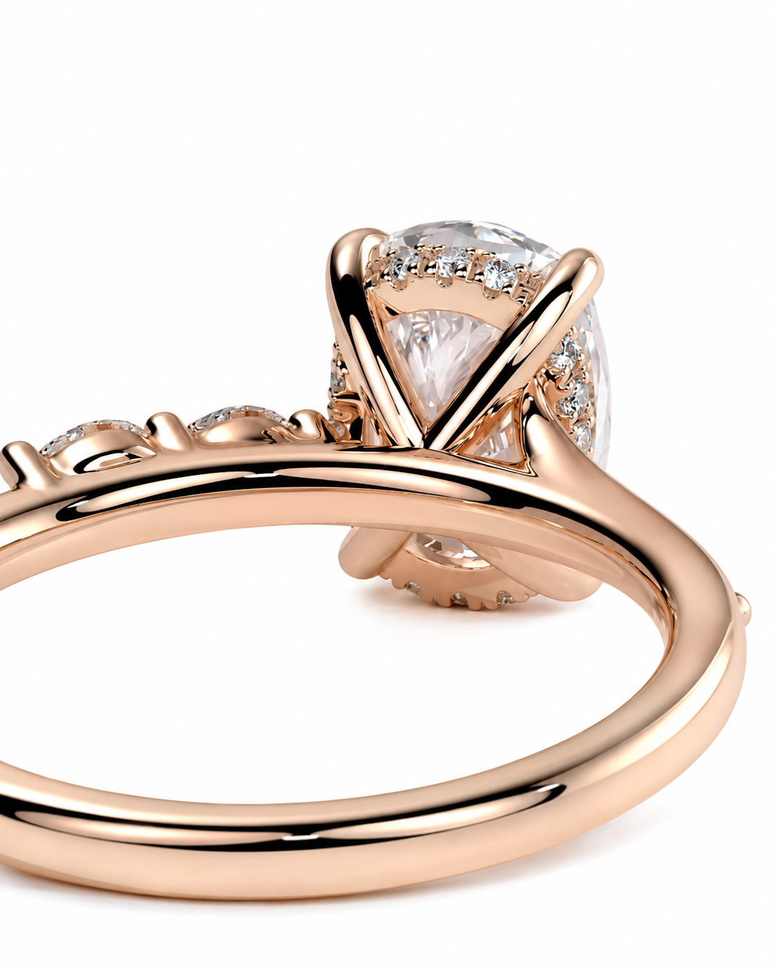color_10K_RG, color_14K_RG &&
Rose gold ring with a large oval clear gemstone in a prong setting, accented with smaller stones along the band, shown on a white background.