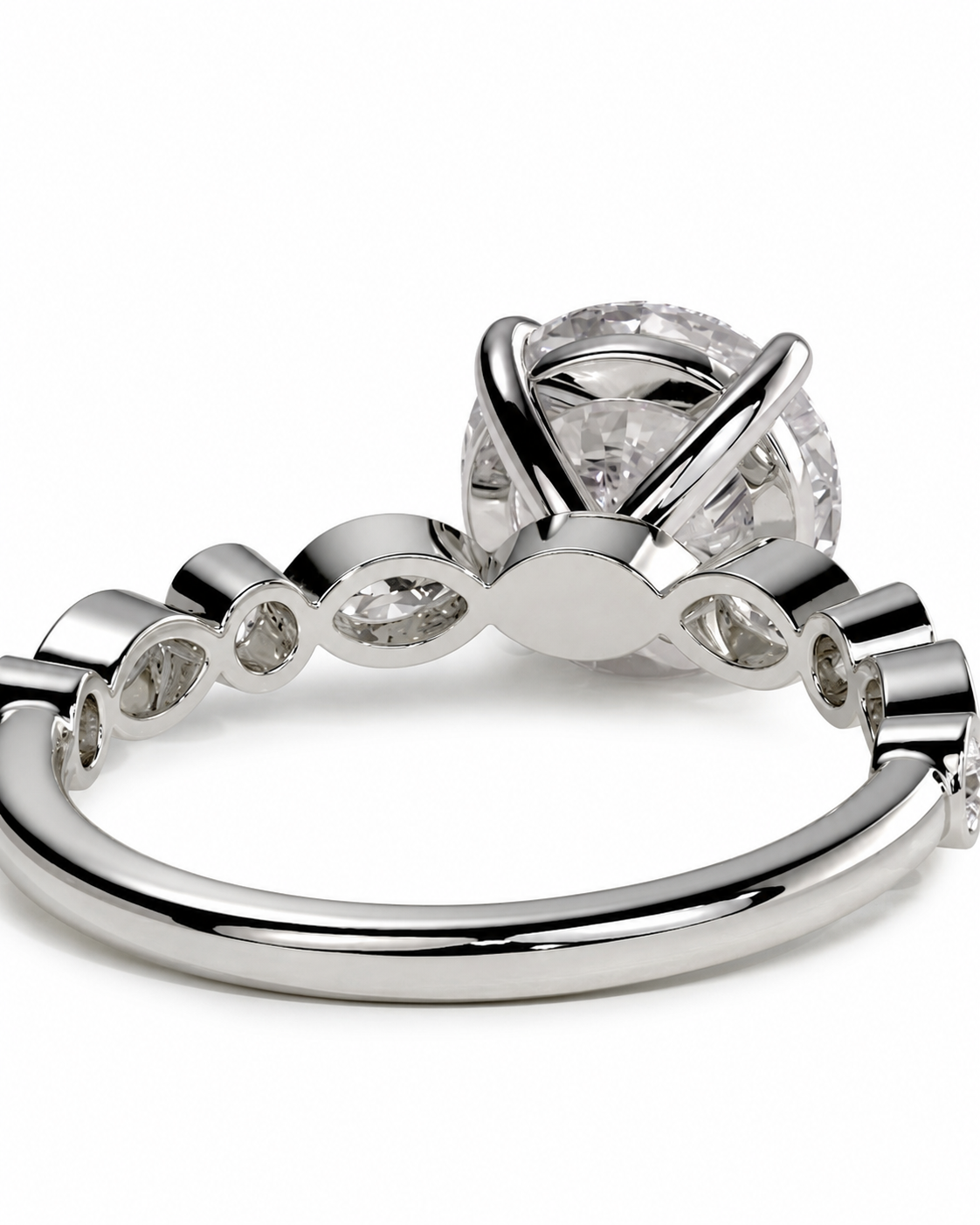 color_925_SIL,color_935_ARG,color_10K_WG, color_14K_WG &&
A close-up studio shot of a silver-toned ring with a large clear round center stone and smaller clear stones along the band, set against a plain white background.