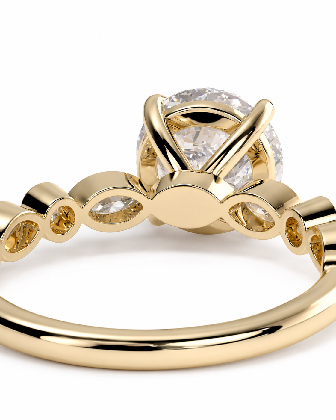 color_10K_YG, color_14K_YG &&
A close-up of a yellow gold ring featuring a large round clear gemstone in a prong setting, with marquise-cut gemstones along the band, shown on a white background.