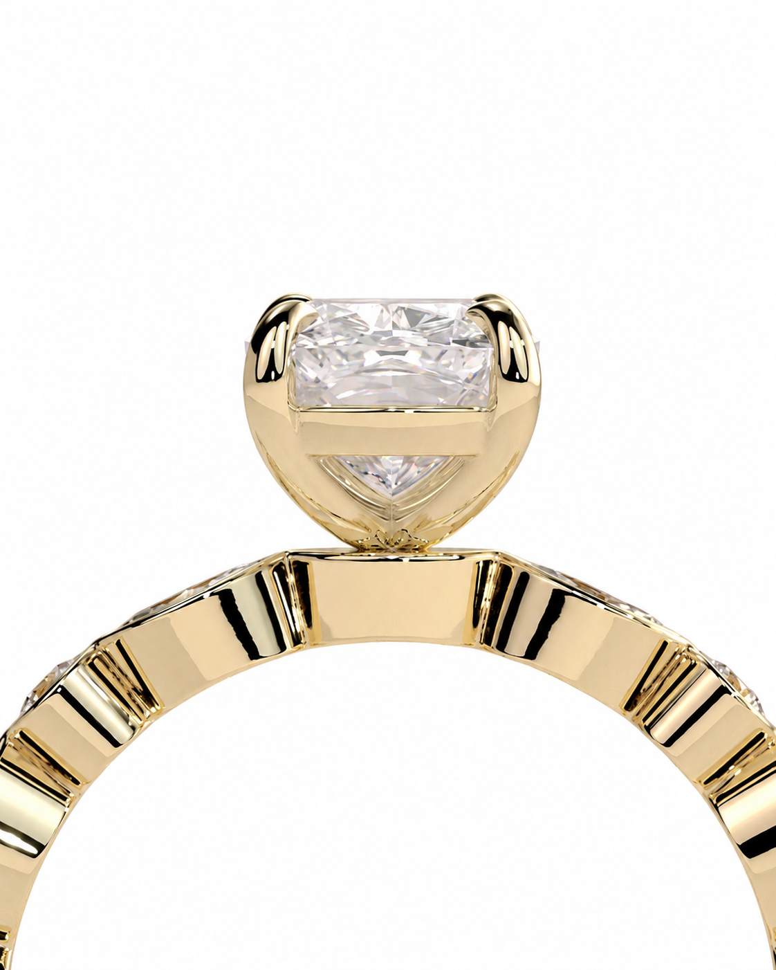 color_10K_YG, color_14K_YG &&
A close-up shot of a yellow gold ring featuring a cushion-cut clear gemstone in a prong setting, with a matching diamond-shaped accent below it and a fluted band, shown against a plain white background.