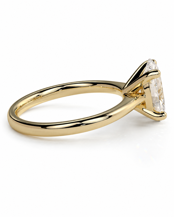 color_10K_YG, color_14K_YG &&A yellow gold solitaire engagement ring featuring a marquise-cut clear gemstone in a prong setting, shown on a clean white background.