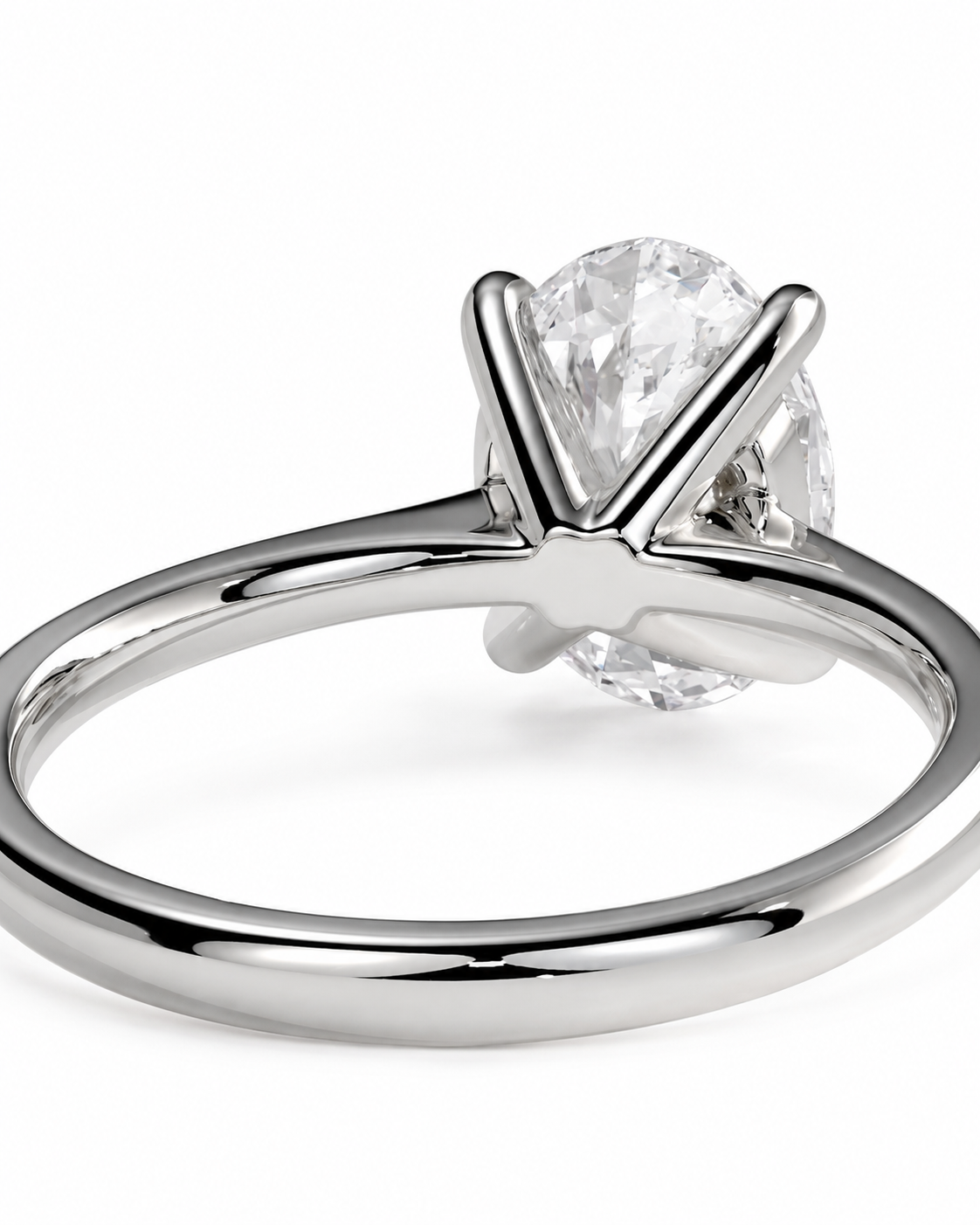 color_925_SIL,color_935_ARG,color_10K_WG, color_14K_WG &&A close-up studio shot of a silver-toned solitaire engagement ring with a clear oval-cut diamond, set against a plain white background.