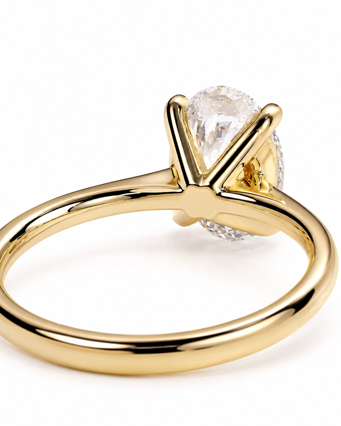 color_10K_YG, color_14K_YG &&A close-up shot of a yellow gold ring with a large oval clear gemstone in a prong setting, accented by a halo of small round diamonds on a white background.