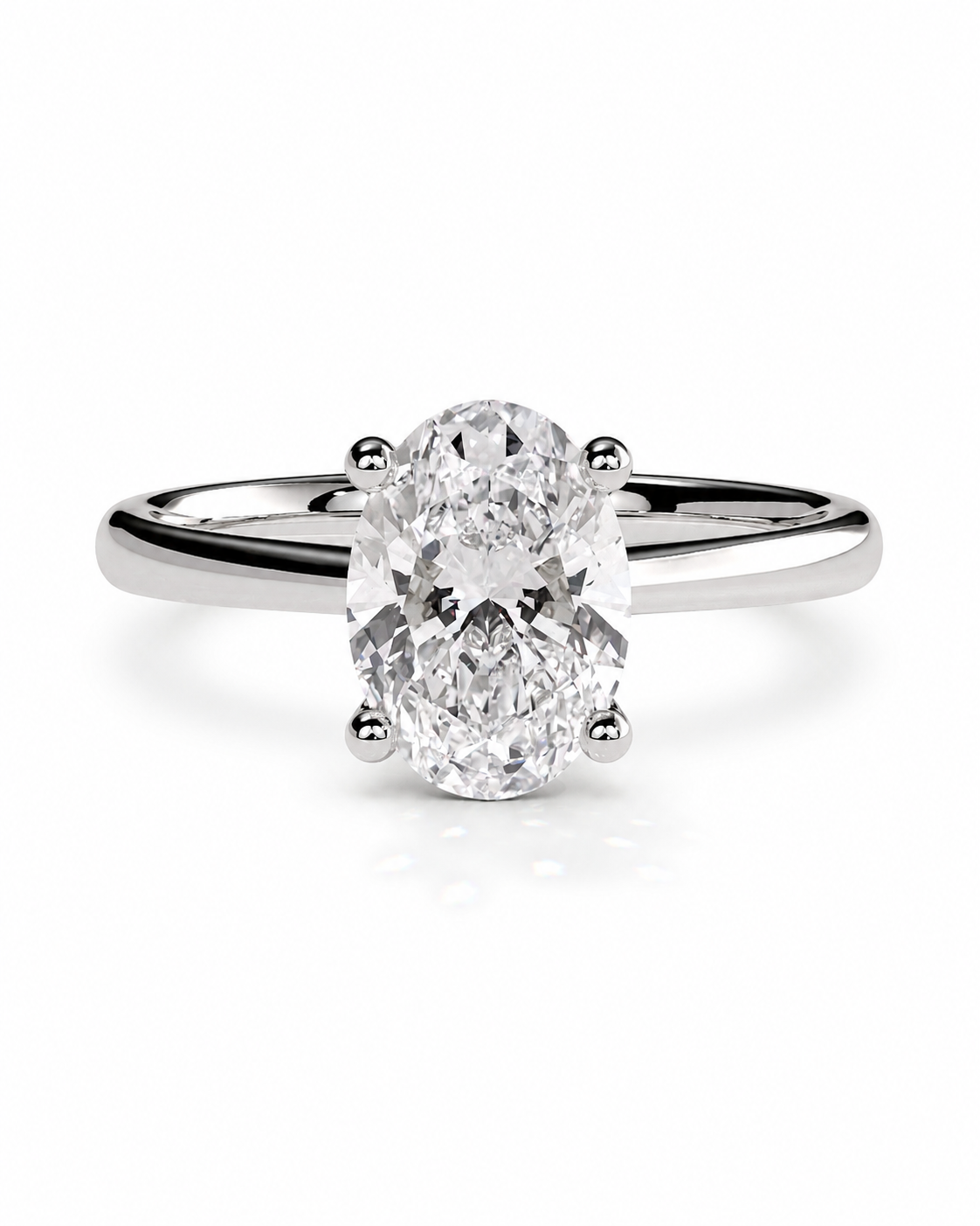 color_925_SIL,color_935_ARG,color_10K_WG, color_14K_WG &&An oval-cut diamond solitaire ring set in a polished silver-colored band, shown against a clean white background.