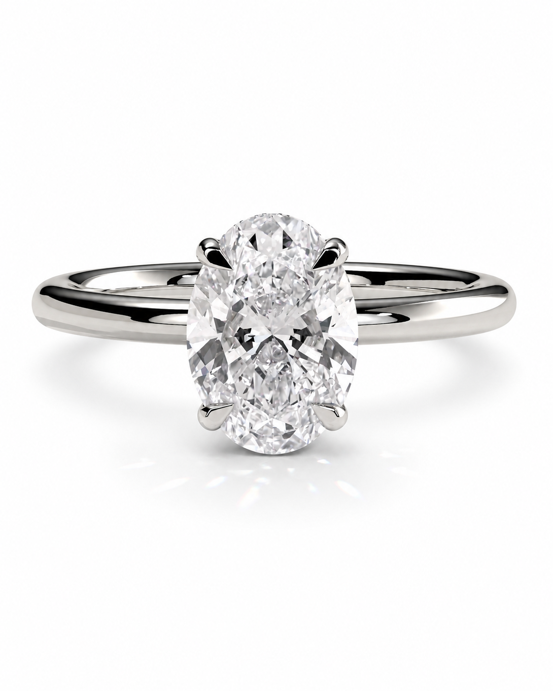 color_925_SIL,color_935_ARG,color_10K_WG, color_14K_WG &&An oval-cut diamond engagement ring with a polished silver-colored band, set against a clean white background.