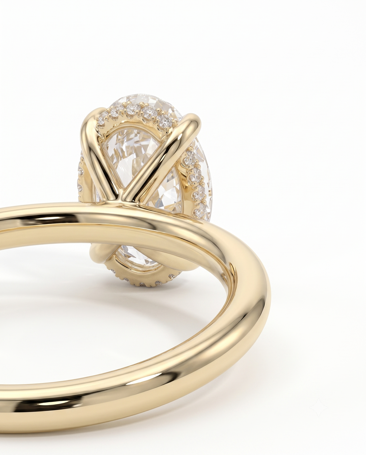 color_10K_YG, color_14K_YG &&A close-up studio shot of a gold ring featuring a large oval clear gemstone surrounded by small pave-set diamonds, with a polished yellow gold band in the foreground on a white background.