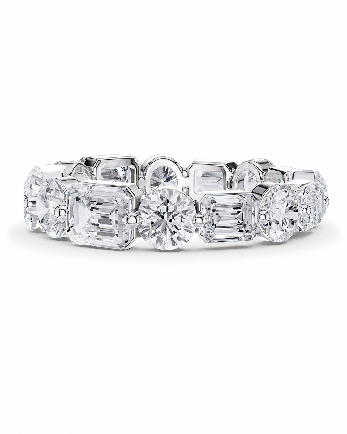 color_925_SIL,color_935_ARG,color_10K_WG, color_14K_WG &&	
A diamond eternity band ring in a silver-colored metal setting, featuring a continuous row of round, emerald, and baguette-cut diamonds on a clean white background.