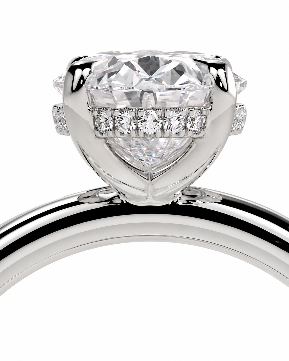 color_925_SIL,color_935_ARG,color_10K_WG, color_14K_WG &&A close-up studio shot of a heart-shaped diamond engagement ring in a silver-colored setting, featuring a halo of smaller diamonds along the band, on a plain white background.