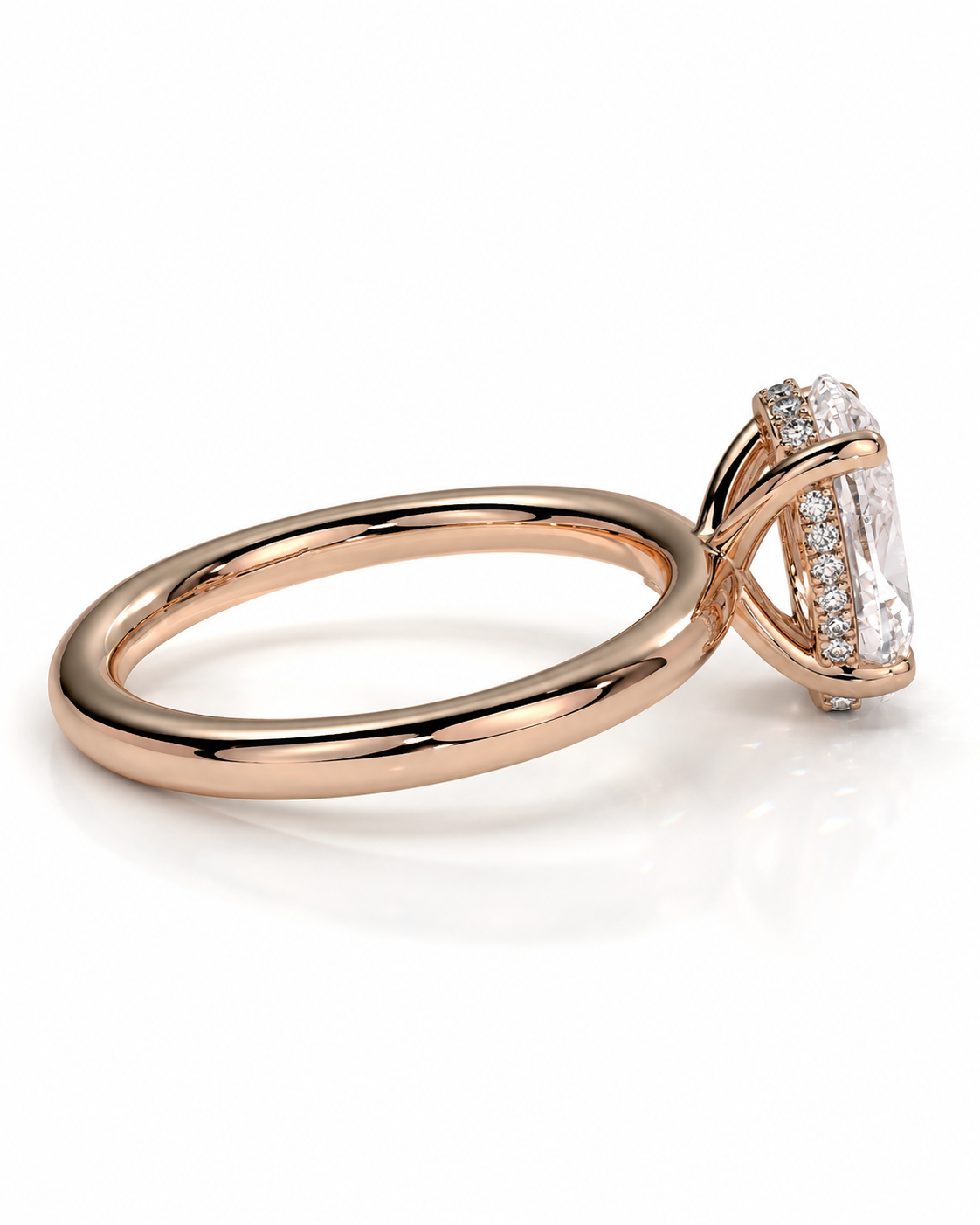 color_10K_RG, color_14K_RG &&Rose gold ring with a large rectangular clear center stone and a halo of small clear stones on a white background.