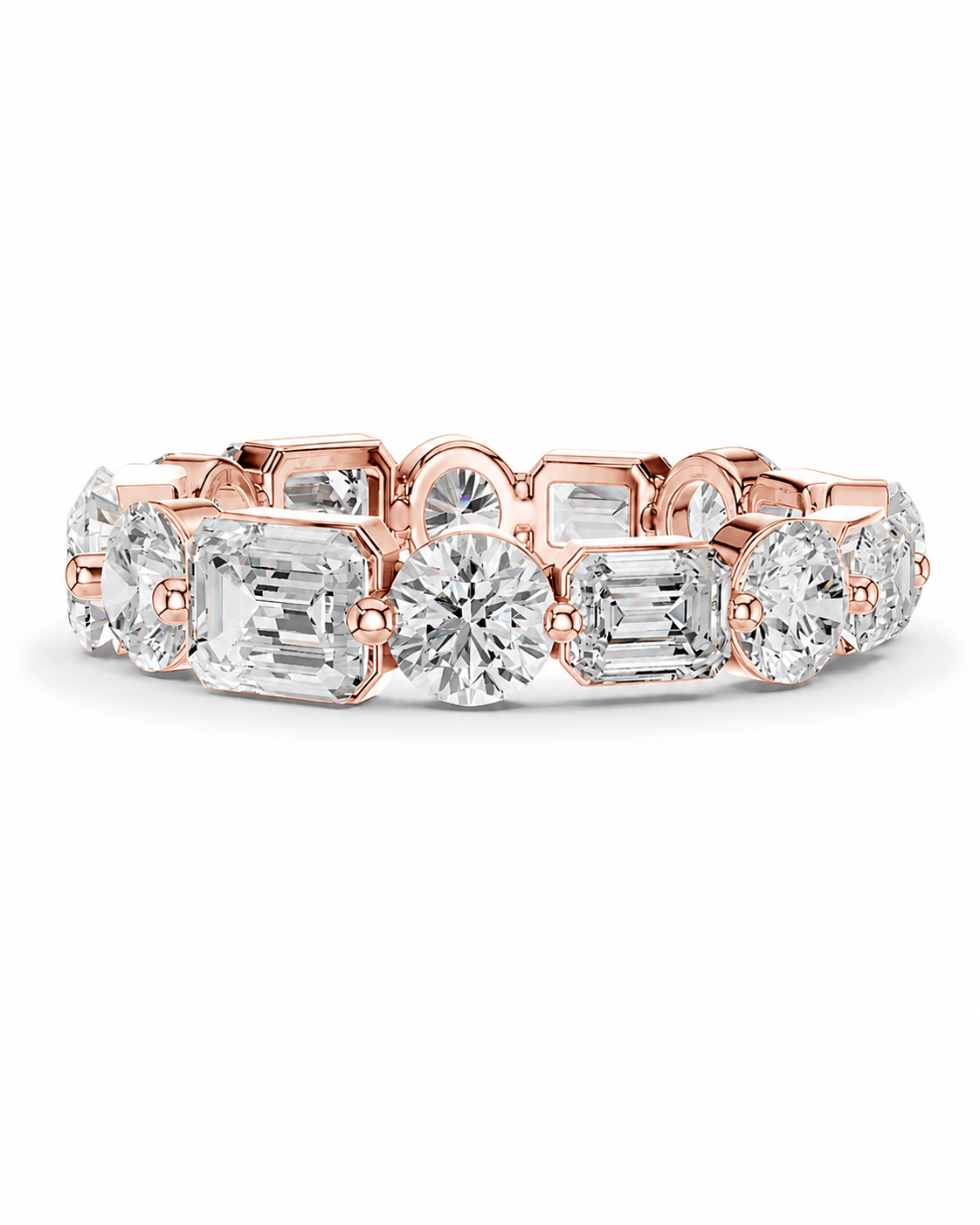 color_10K_RG, color_14K_RG &&	A rose gold eternity band featuring a row of clear baguette and round-cut diamonds, photographed on a clean white background.