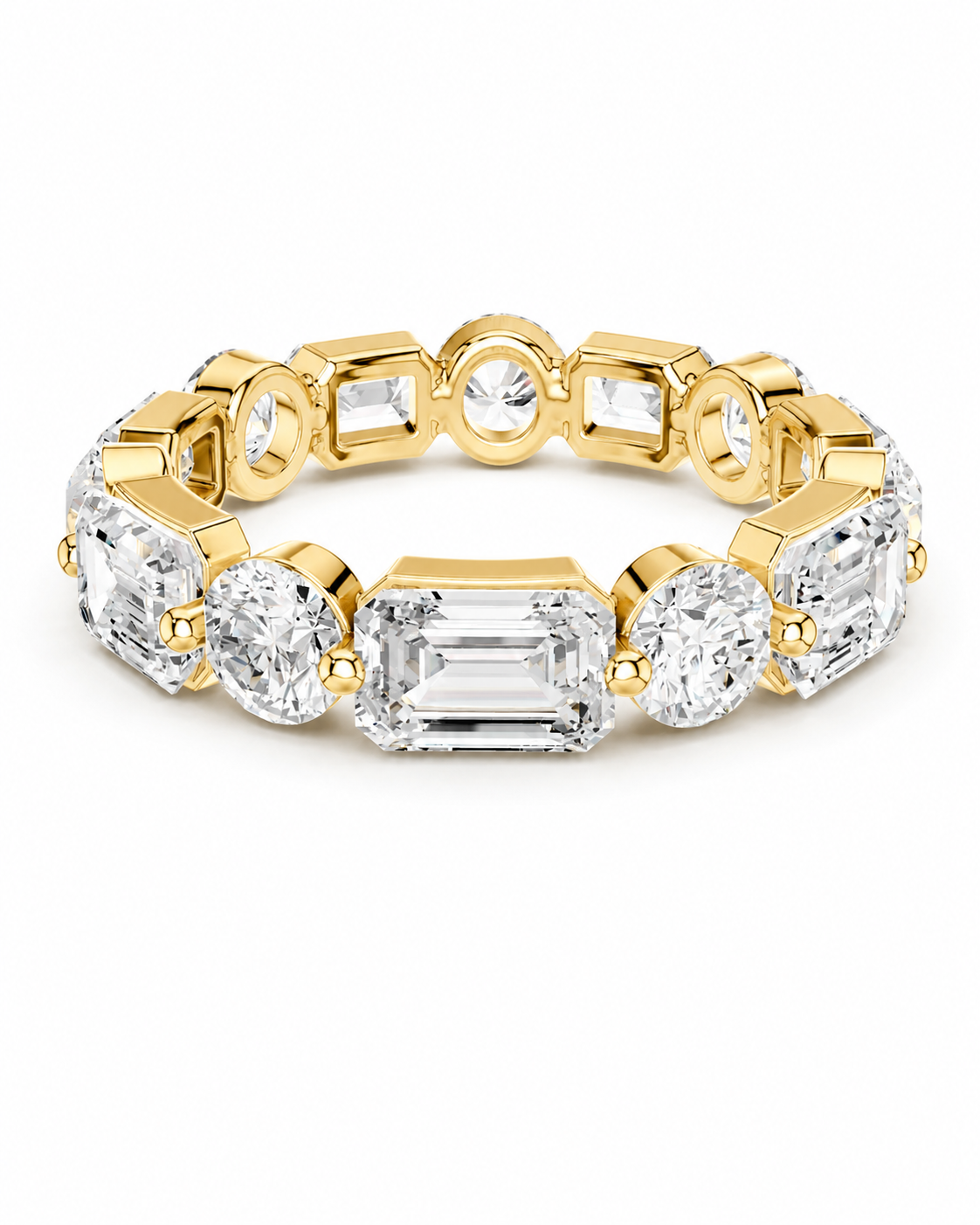 color_10K_YG, color_14K_YG &&	
A yellow gold eternity-style ring featuring a central baguette-cut clear gemstone surrounded by round and rectangular clear gemstones in gold settings, shown on a plain white background.