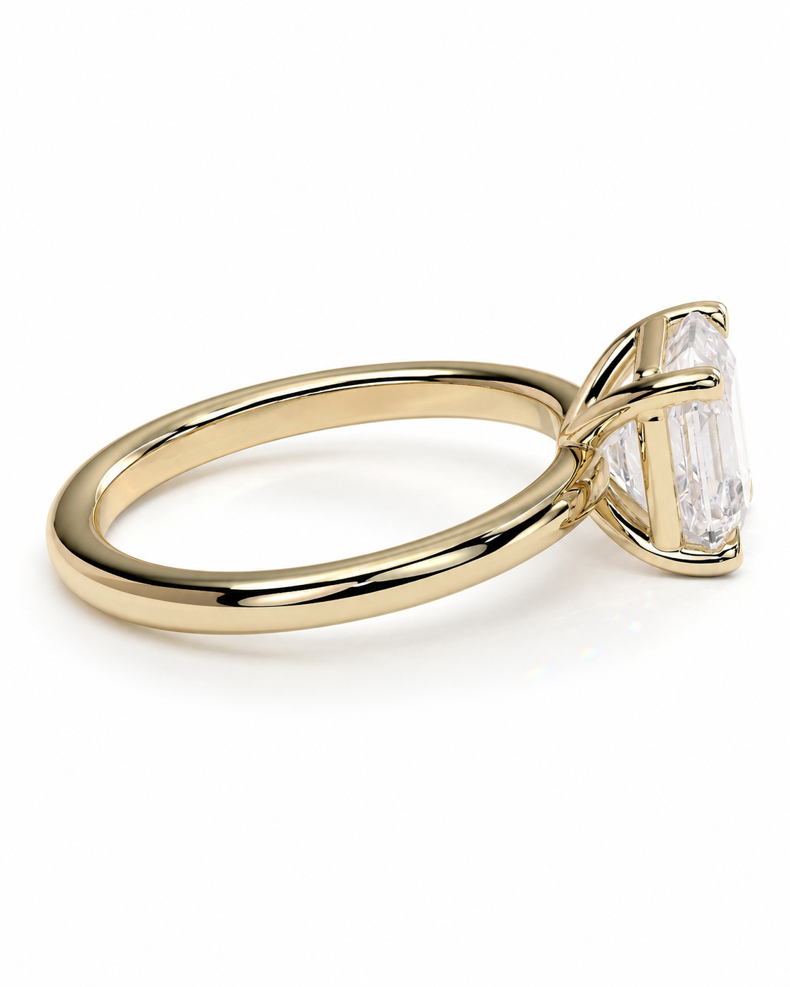 color_10K_YG, color_14K_YG &&A yellow gold ring with a large clear baguette-cut gemstone in a four-prong setting, shown on a clean white background.
