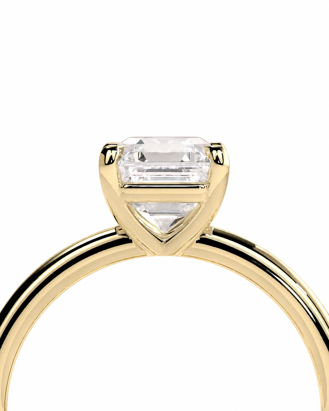 color_10K_YG, color_14K_YG &&A close-up of a yellow gold ring featuring a triangular bezel setting with a clear emerald-cut diamond and a smaller marquise-cut diamond, shown against a plain white background.
